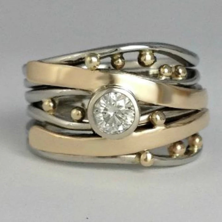 Anillo con Circonita en Oro y Plata